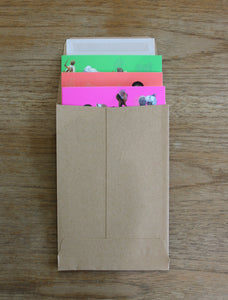 Three greeting cards inside brown envelop.