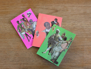 Three greeting cards laid out on a wooden table.